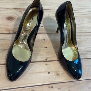 Antonio Melani black patent leather pumps.